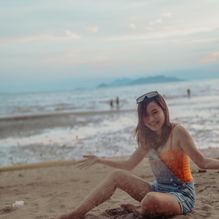 Kaveri Mehta, Lead Design Curator at GrovePaperStudio, reviewing corporate floral arrangements